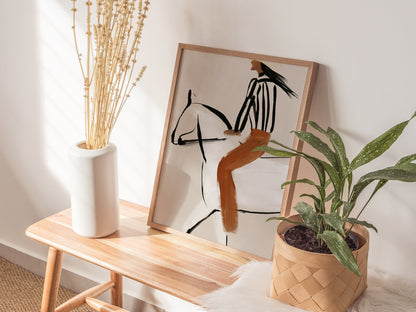 Rider Turns West Poster | Rust and Cream Illustrative Art Print | Western Wall Art — styled in an interior