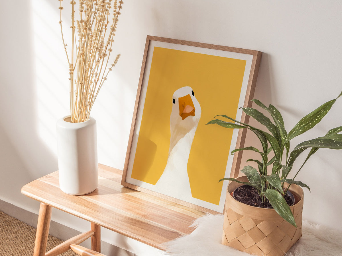 Goose Tilts Head Poster | White and Gold Flat Design Art Print | Kids Room Wall Art — styled in an interior