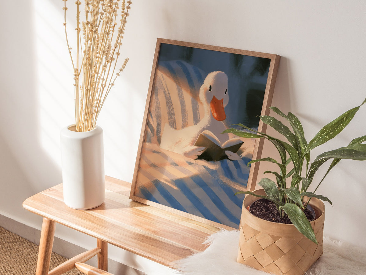 Duck Reads in Bed Poster | Soft Blue Illustrative Art Print | Kids Room Wall Art — styled in an interior