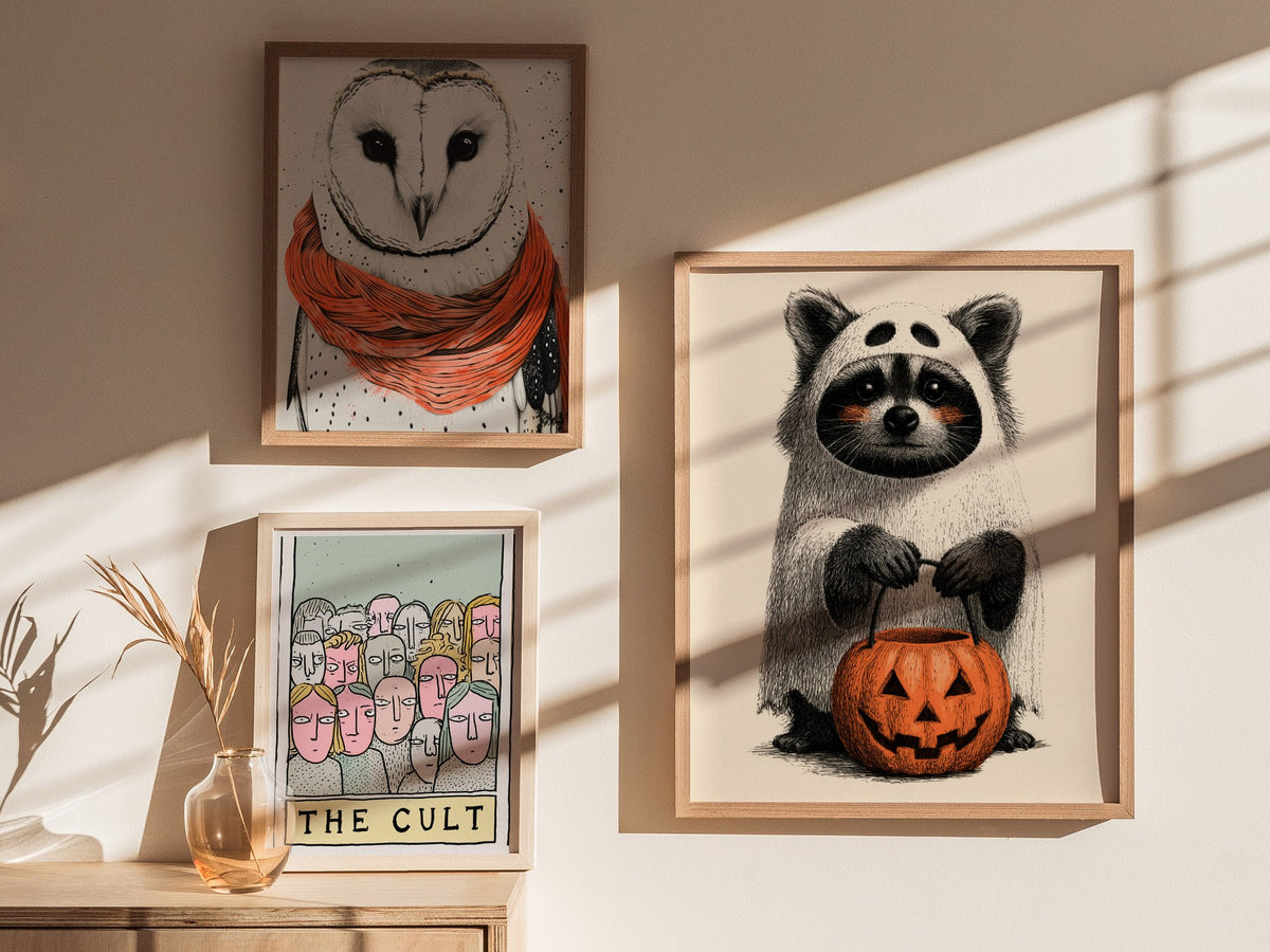 Raccoon Trick-or-treats Poster | Gray and Orange Pen and Ink Art Print | Halloween Wall Art — styled in an interior