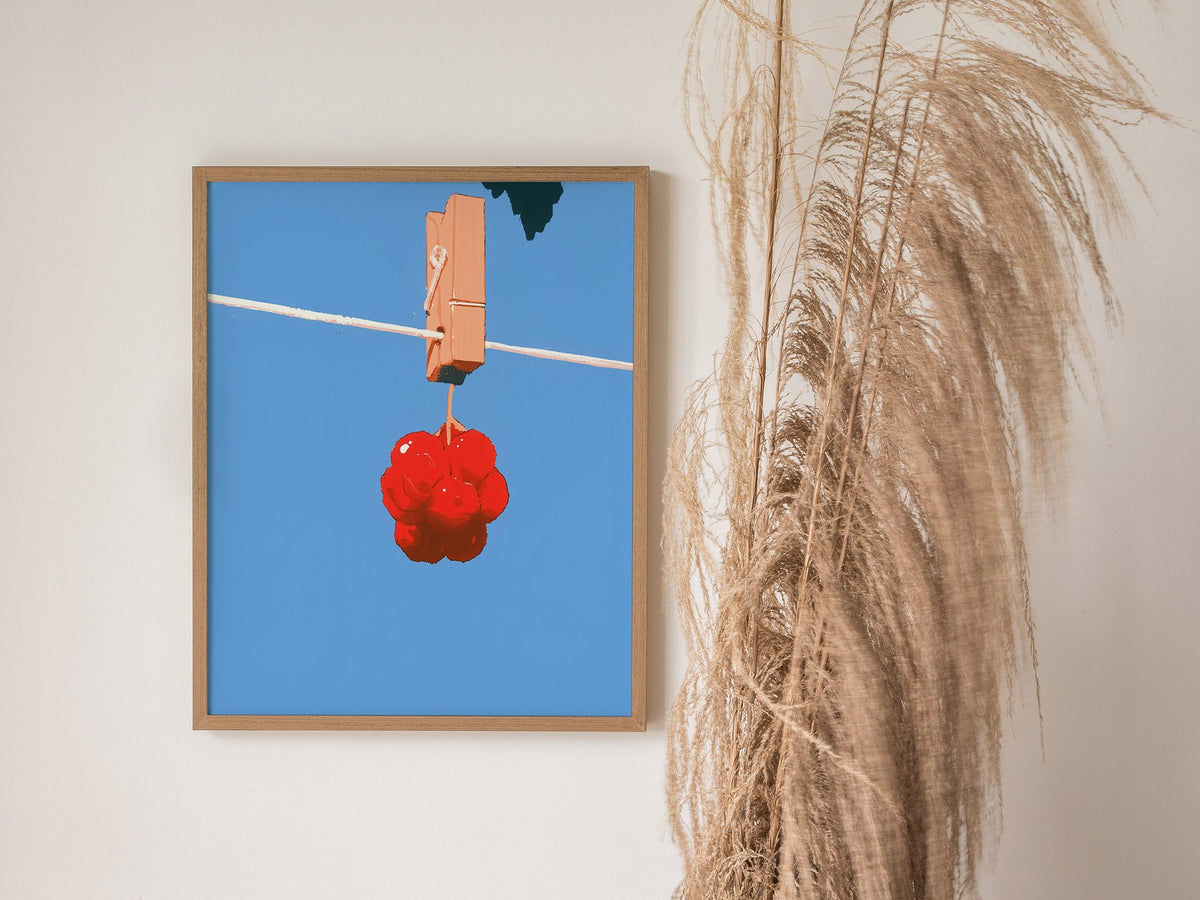 Cherries Hang Drying Poster | Red and Blue Illustrative Art Print | Kitchen Wall Art — styled in an interior