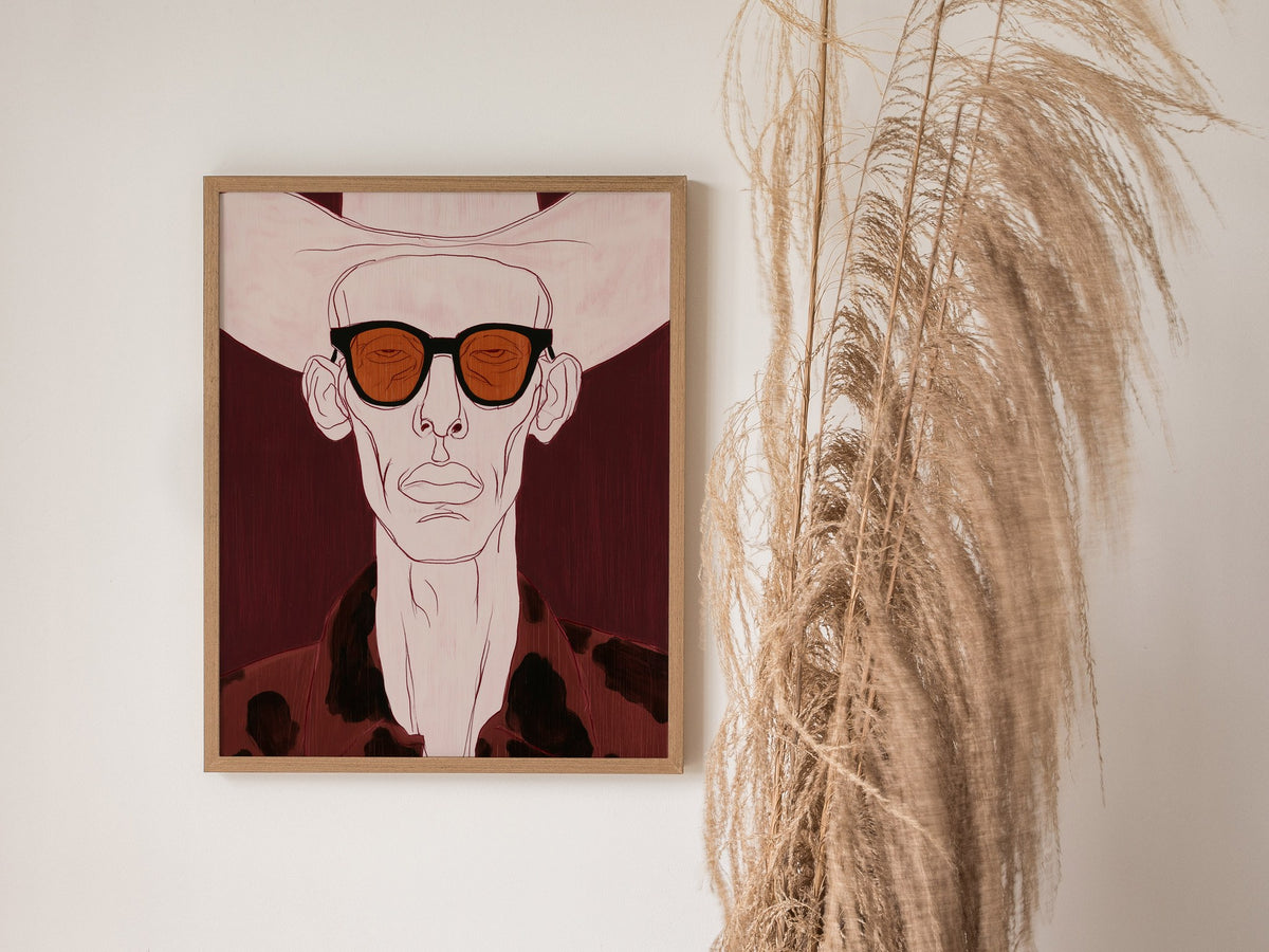 Cowboy Behind Shades Poster | Burgundy Red Illustrative Art Print | Western Gothic Wall Art — styled in an interior