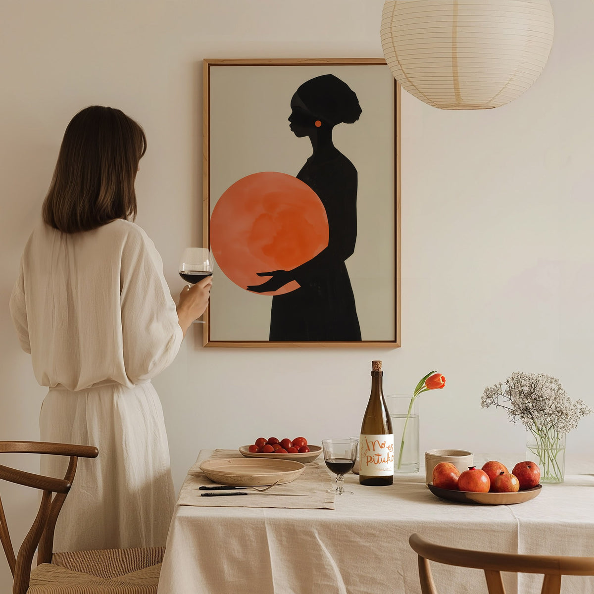 Woman with Orange Sphere Poster | Coral and Black Minimalism Art Print | Minimalist Wall Art — styled in an interior